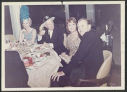 Hoagy Carmichael at a party with three unidentified people.
