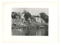 People wading in the Ganges at a ghat