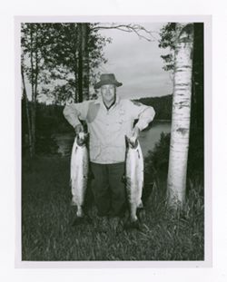 Man holds a salmon