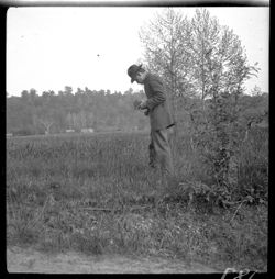Elkins in field with camera