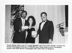 Danny Glover accepting award from Miss Mumm Champagne and Clyde Allen