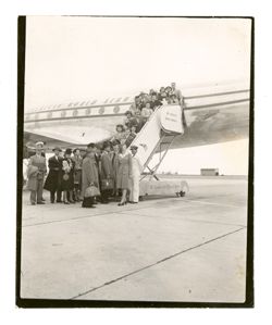 Passengers disembarking a plane