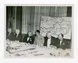 Roy Howard and others at a meeting