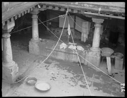 Patio at Innes home, with figure, showing washing quarters