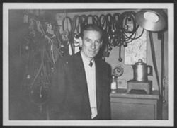 Hoagy Carmichael standing in front of electrical equipment.