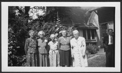 Five members of the Robison family posing in yard during a family reunion at house on 3120 Graceland Avenue, Indianapolis, Indiana.