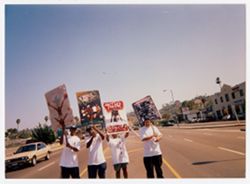 Street team holding promotional picket signs on La Brea Ave. near Wherehouse record store