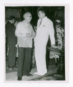 Roy Howard standing with Ramon Magsaysay