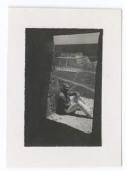 Item 1008. Similar shots of Eisenstein, Alexandrov and Tissé seated on the upper platform of the Castillo, seen through the doorway of the temple. The doorway is in heavy shadow, the men are leaning against the wall outside the door.
