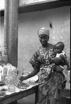 Women glass vendor with child