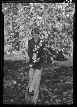Marian Gravis among apple blooms