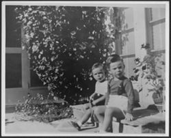 Randy (left) and Hoagy Bix Carmichael (right) sitting on a porch.