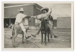 Item 0408d.  Various shots of Eisenstein and man seen in Items 398, 401-407 above, riding donkeys in courtyard of Hacienda. On back of each, written in pencil: "4."