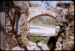 An archway in ruins of Espada Mission