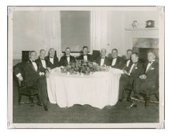 Roy W. Howard and associates at a formal meeting