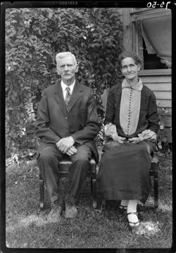 Mr. and Mrs. Greenberry Snyder, sitting