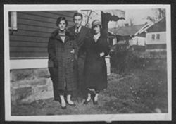 Martha, Hoagy, and Georgia Carmichael outside house on Washington Avenue, Bloomington, Indiana.