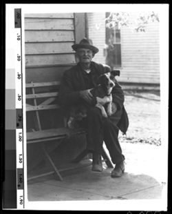 "Dick" Mobley, the old-time barber and his pet dog