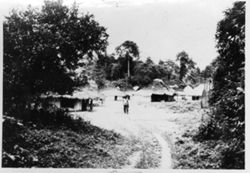 Man walking through the middle of village