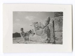 Item 1030. - 1031b. Various shots of individuals framed in the open jaws of one of the serpents at the entrance to the upper temple of the Temple of the Warriors. - Eisenstein