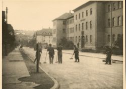 German Prisoners of War sweep the street