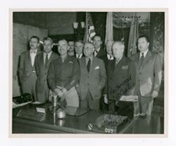 Roy Howard and other men standing together