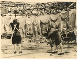 Women hanging clothes to dry