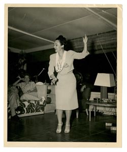 Woman performs for a group of people