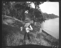 Miss Moorehouse with field glasses, up White River