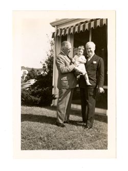 Roy Howard holds a child