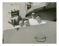 Roy W. Howard and other men on a ship