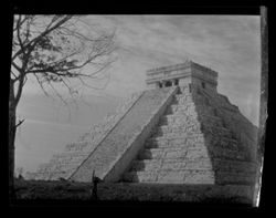 Item 0154. Various similar views of the Castillo, some with trees and/or other foliage visible. Medium shot from another angle. Tree, with few leaves, at far left. Far right side of one copy blurred.