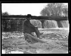 Fisherman on rock at Sugar Creek dam, Johnson Co.