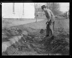 Elmer Hinshaw digging near I.O.O.F. building