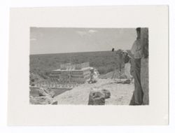 Item 1004. - 1004a. Various shots of Eisenstein with Alexandrov, Tissé and an unidentified man (separately) on the upper platform of the Castillo. Eisenstein seated or kneeling at corner of platform, other men standing behind camera.