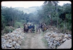 Selega road workers use tractor for the big rocks