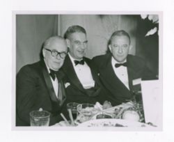 Roy Howard and other men at an event