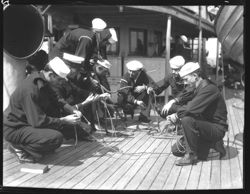 Sailors learning to tie knots