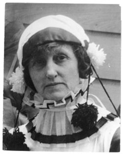 Musette Stoddard wearing hat with pom poms
