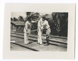 Item 1216. Eisenstein, Kimbrough and man seen in Item 1215 above standing on railroad tracks.