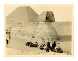 Margaret Howard and others on camels in front of the Great Spinx and Great Pyramid