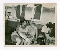 Man and woman sitting on couch