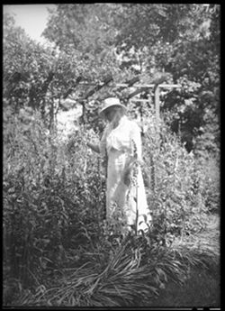 Mrs. Steele in flower garden