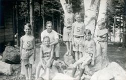 Summer Camp: group of boys, counselor, and rocks