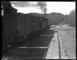 Thumbnail for Train on siding with mountains in distance