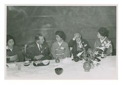 Roy W. Howard and acquaintances at dinner