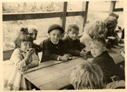 Polish children eating at DP Camp nursery program