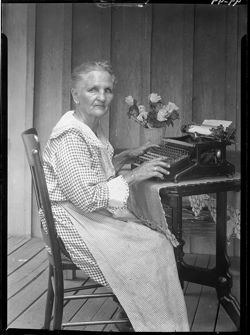 Mandy Mason at typewriter, front view