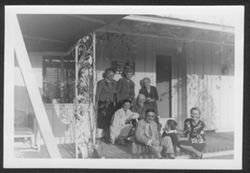 Ruth and Hoagy Carmichael, Hoagy Bix, Lida Carmichael and other family members posing in front of house.