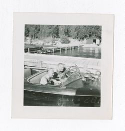 Two men sitting in a boat